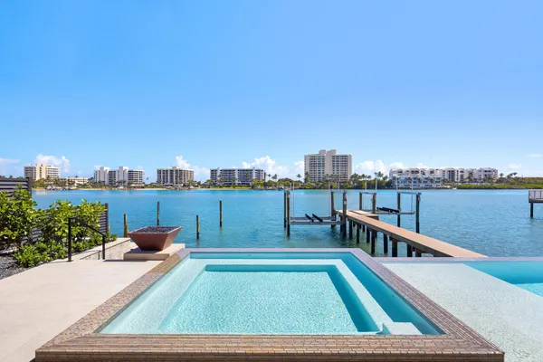 a spacious bathroom with a double vanity sink and a mirror