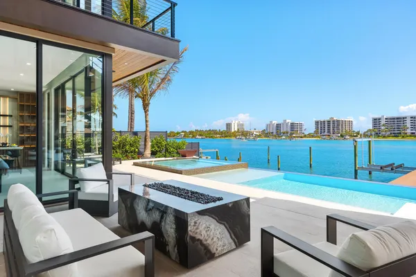 a bathroom with a double vanity sink mirror and shower
