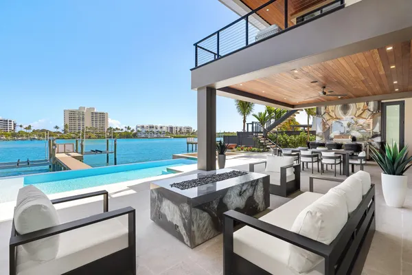 a view of a balcony with table and chairs