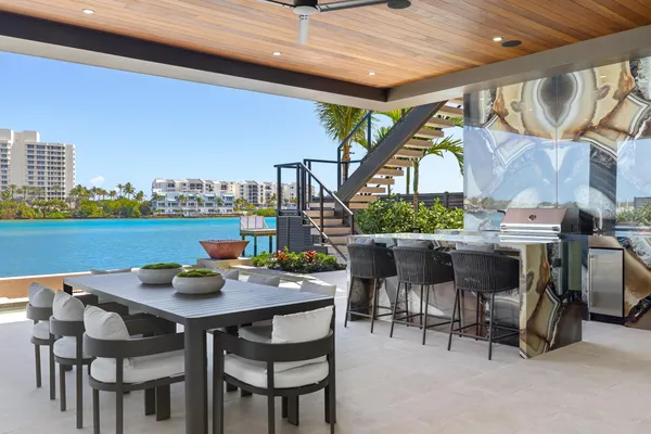 a balcony with furniture and city view