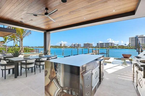 an aerial view of a house with swimming pool garden and patio