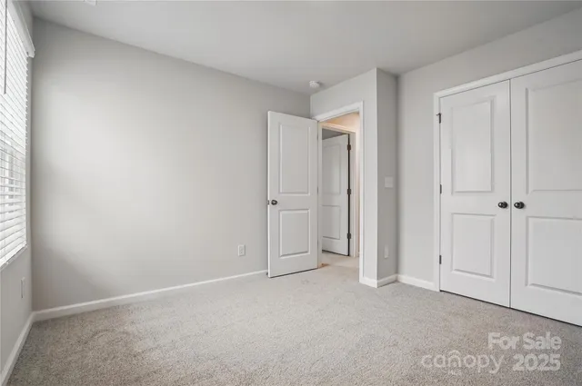 an empty room with closet area