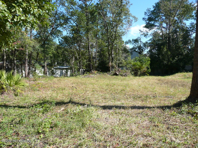 4219 Spring Park Road Jacksonville, FL 32207 - Photo 1 of 4 a view of a yard with large trees