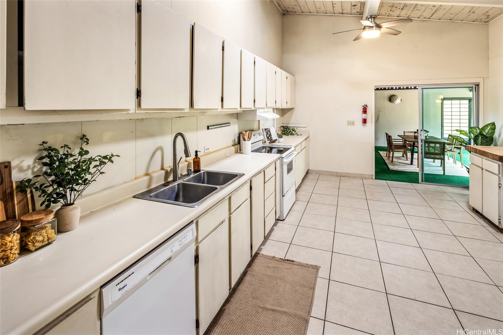 153 Hanapepe Loop Honolulu, HI 96825 - Photo 18 of 22 Large kitchen leading to a covered lanai