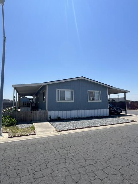 900 East Rankin Road, Unit 110 Tulare, CA 93274 - Photo 8 of 8 a front view of a house with a yard