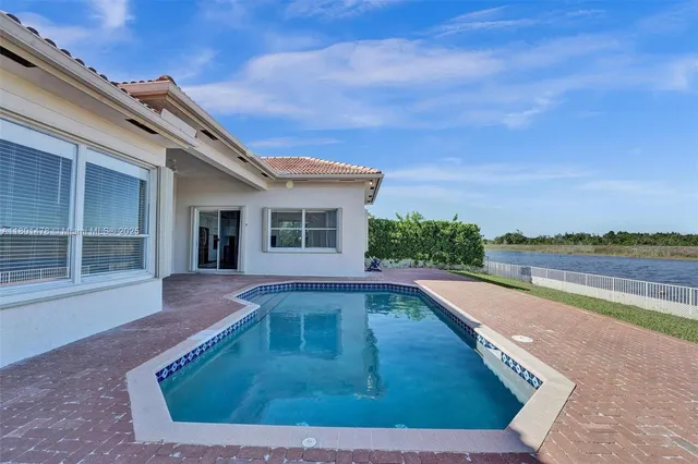 a view of a lake with a yard