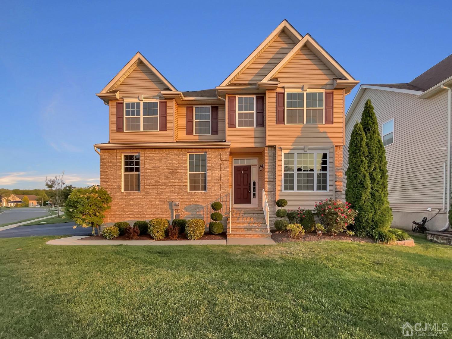 a front view of a house with a yard