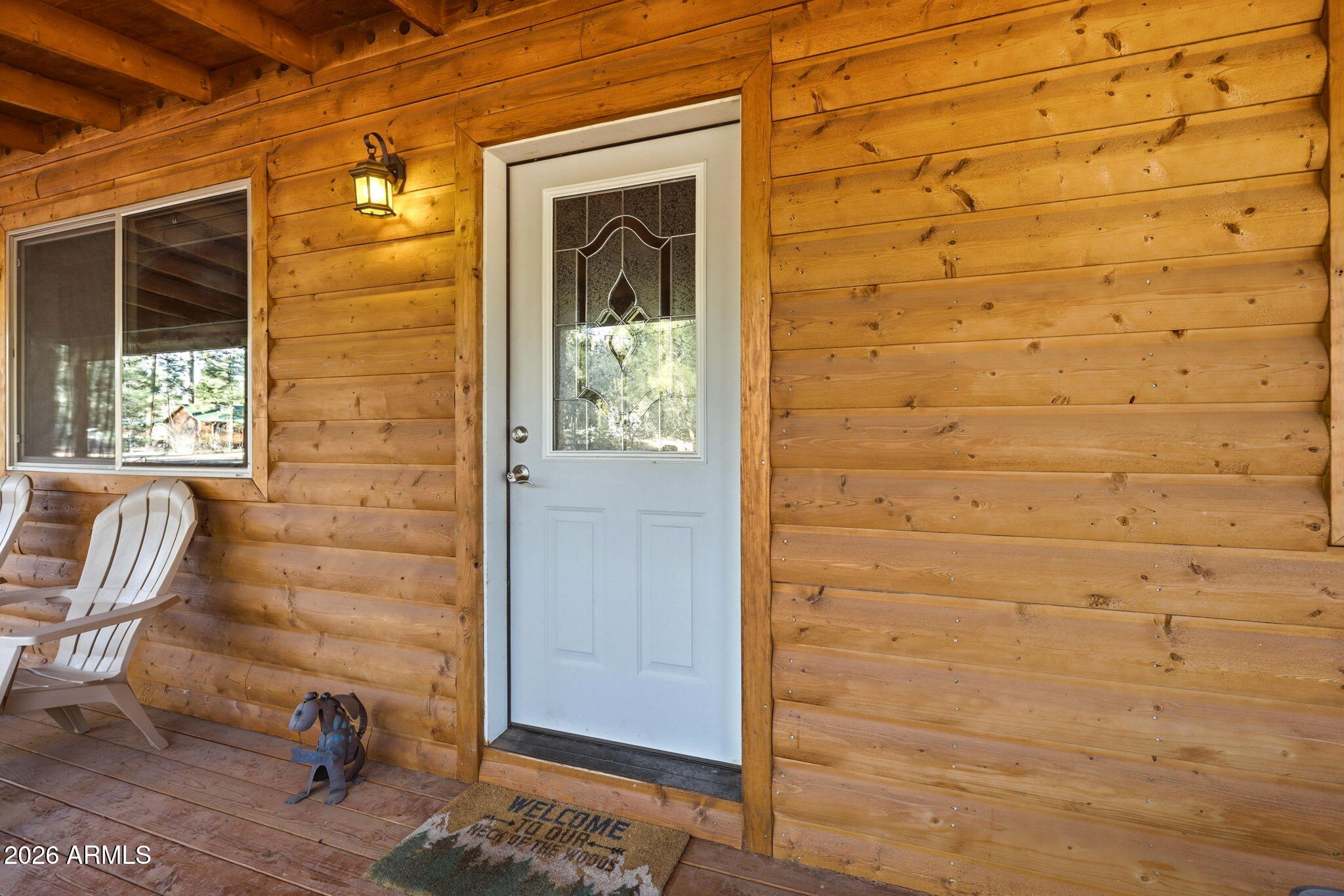 2900 Long Rifle Place Overgaard, AZ 85933 - Photo 6 of 35 a view of door with chair and glass door