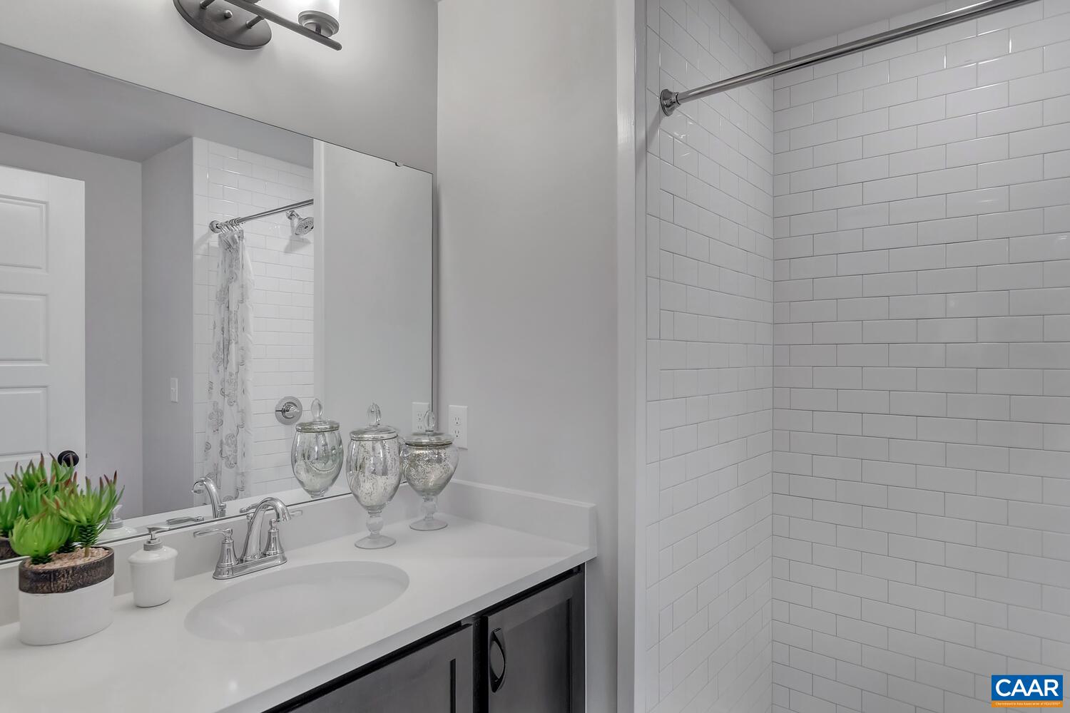 2 Jarmans Gap Road, Unit LOT 2 JARMANS GAP Crozet, VA 22932 - Photo 16 of 33 a bathroom with a sink and a mirror