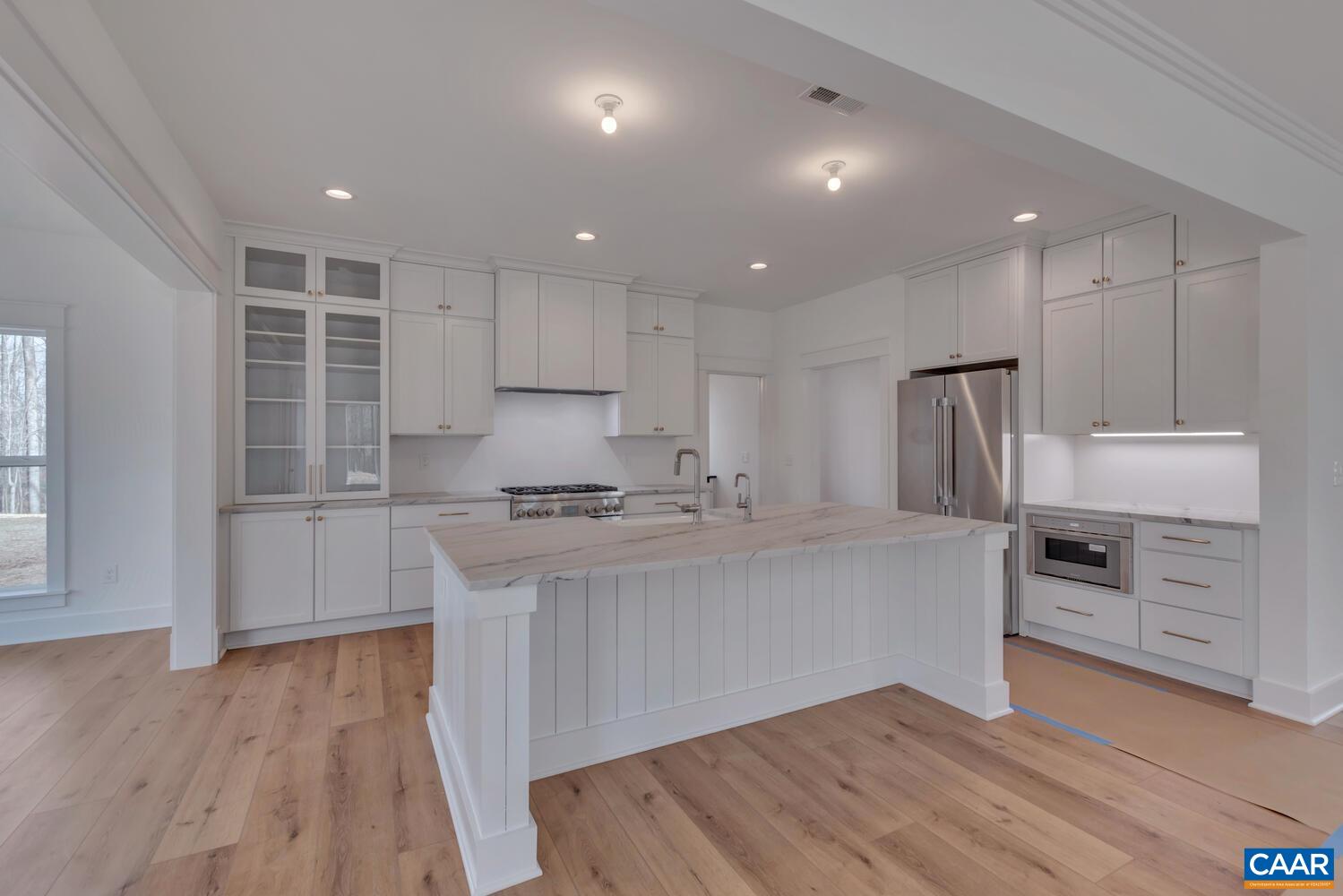 2 Jarmans Gap Road, Unit LOT 2 JARMANS GAP Crozet, VA 22932 - Photo 9 of 33 a large kitchen with cabinets wooden floor and stainless steel appliances