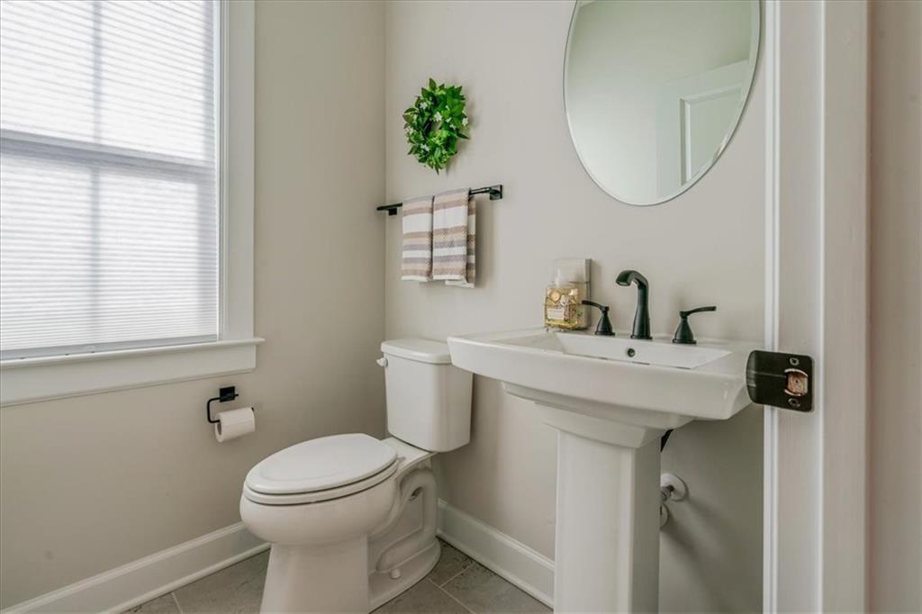 348 Juniper Way Canonsburg, PA 15317 - Photo 12 of 25 a bathroom with a sink a toilet and a mirror