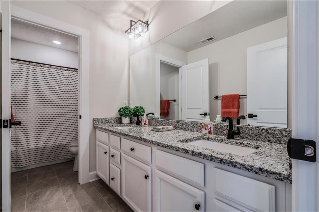 348 Juniper Way Canonsburg, PA 15317 - Photo 20 of 25 a bathroom with a granite countertop sink double and mirror