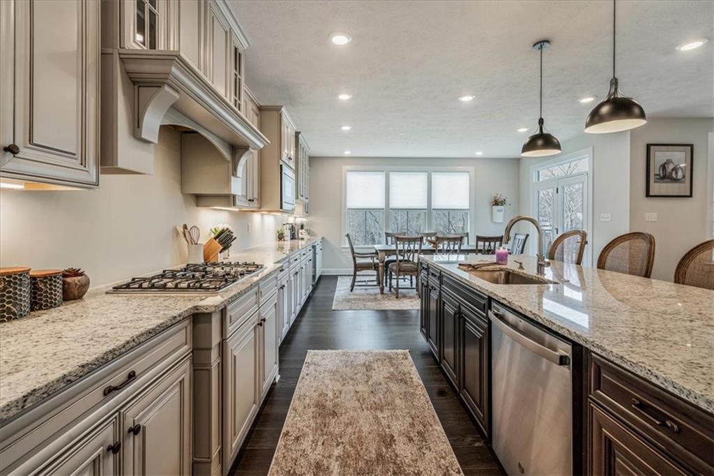 348 Juniper Way Canonsburg, PA 15317 - Photo 4 of 25 a kitchen with stainless steel appliances granite countertop a stove and a sink