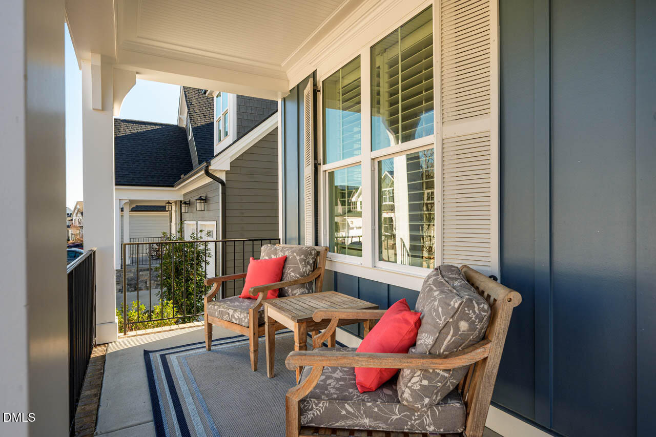 56 Post Oak Road Chapel Hill, NC 27516 - Photo 9 of 84 a living room filled with furniture and a floor to ceiling window
