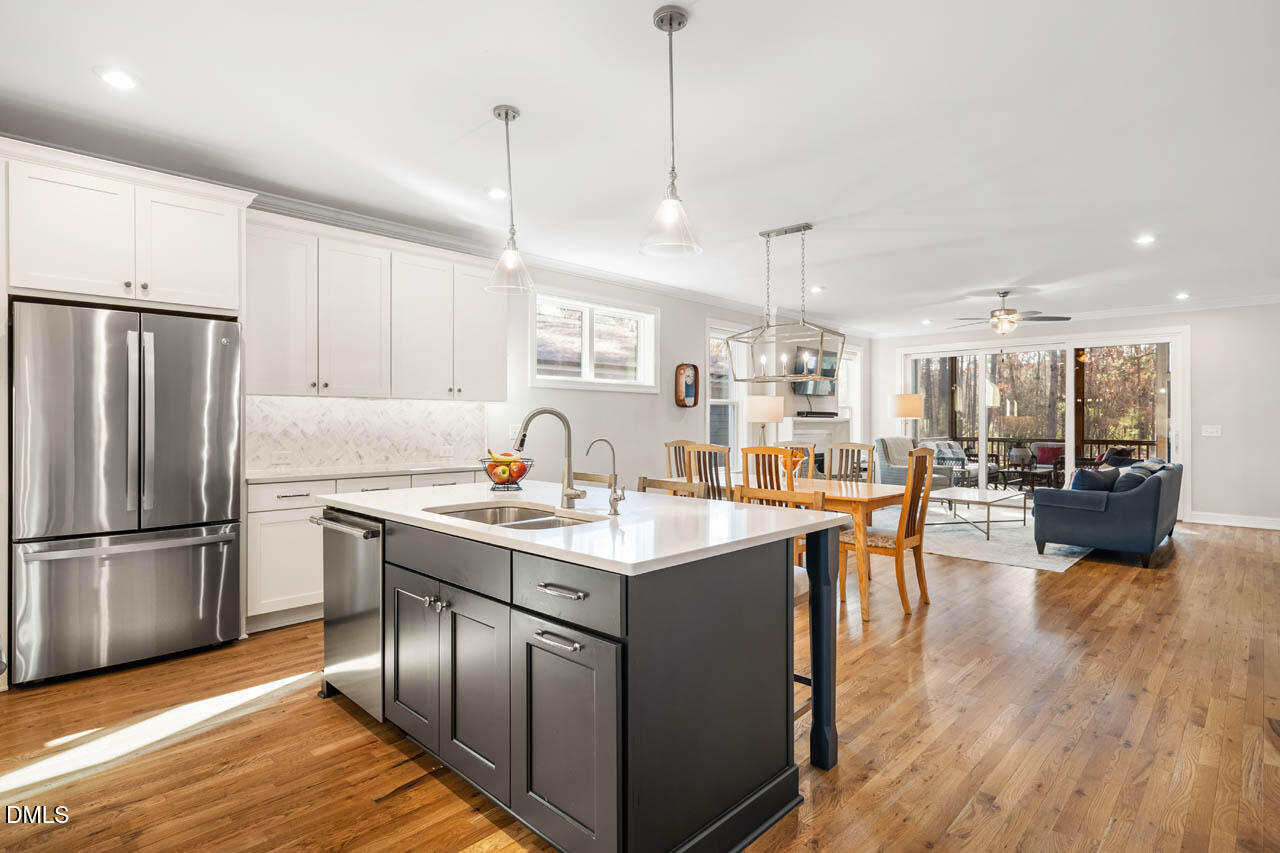 56 Post Oak Road Chapel Hill, NC 27516 - Photo 15 of 84 a kitchen with stainless steel appliances granite countertop a sink a stove and refrigerator