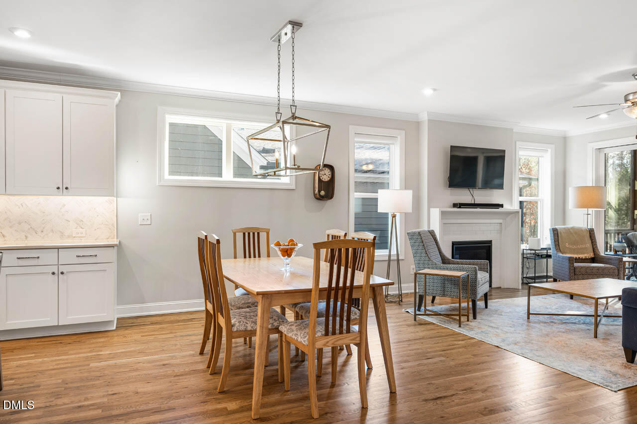 56 Post Oak Road Chapel Hill, NC 27516 - Photo 16 of 84 a view of a dining room with furniture window and wooden floor