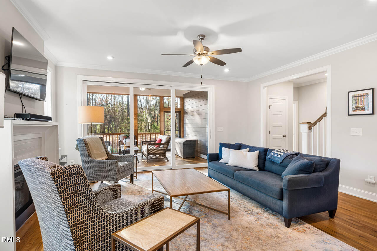 56 Post Oak Road Chapel Hill, NC 27516 - Photo 19 of 84 a living room with furniture ceiling fan and a window