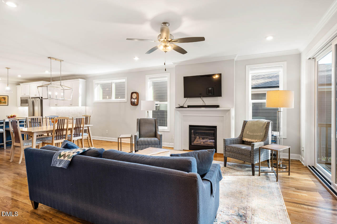 56 Post Oak Road Chapel Hill, NC 27516 - Photo 20 of 84 a living room with furniture a fireplace and a flat screen tv