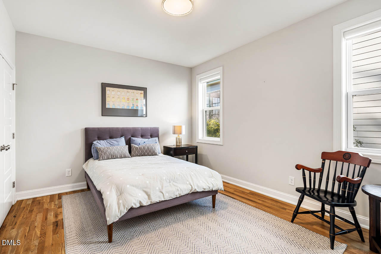 56 Post Oak Road Chapel Hill, NC 27516 - Photo 28 of 84 a bedroom with a bed chair and window