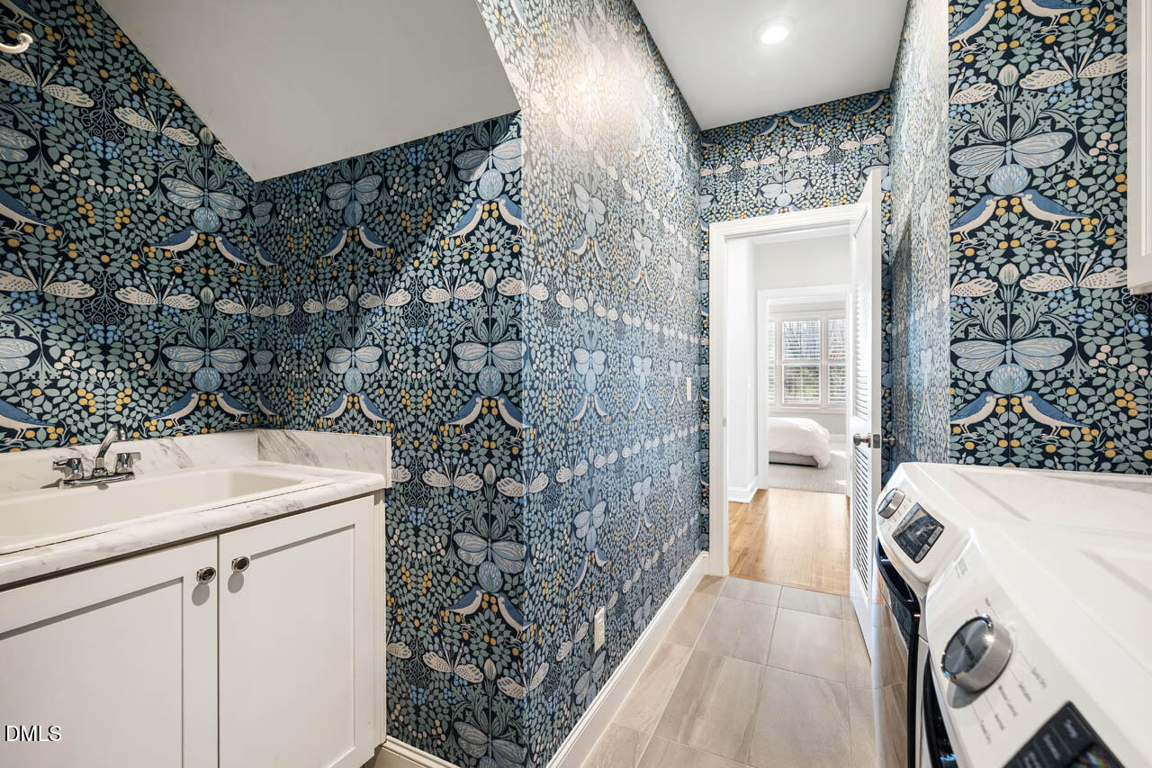 56 Post Oak Road Chapel Hill, NC 27516 - Photo 30 of 84 a bathroom with a sink and a mirror