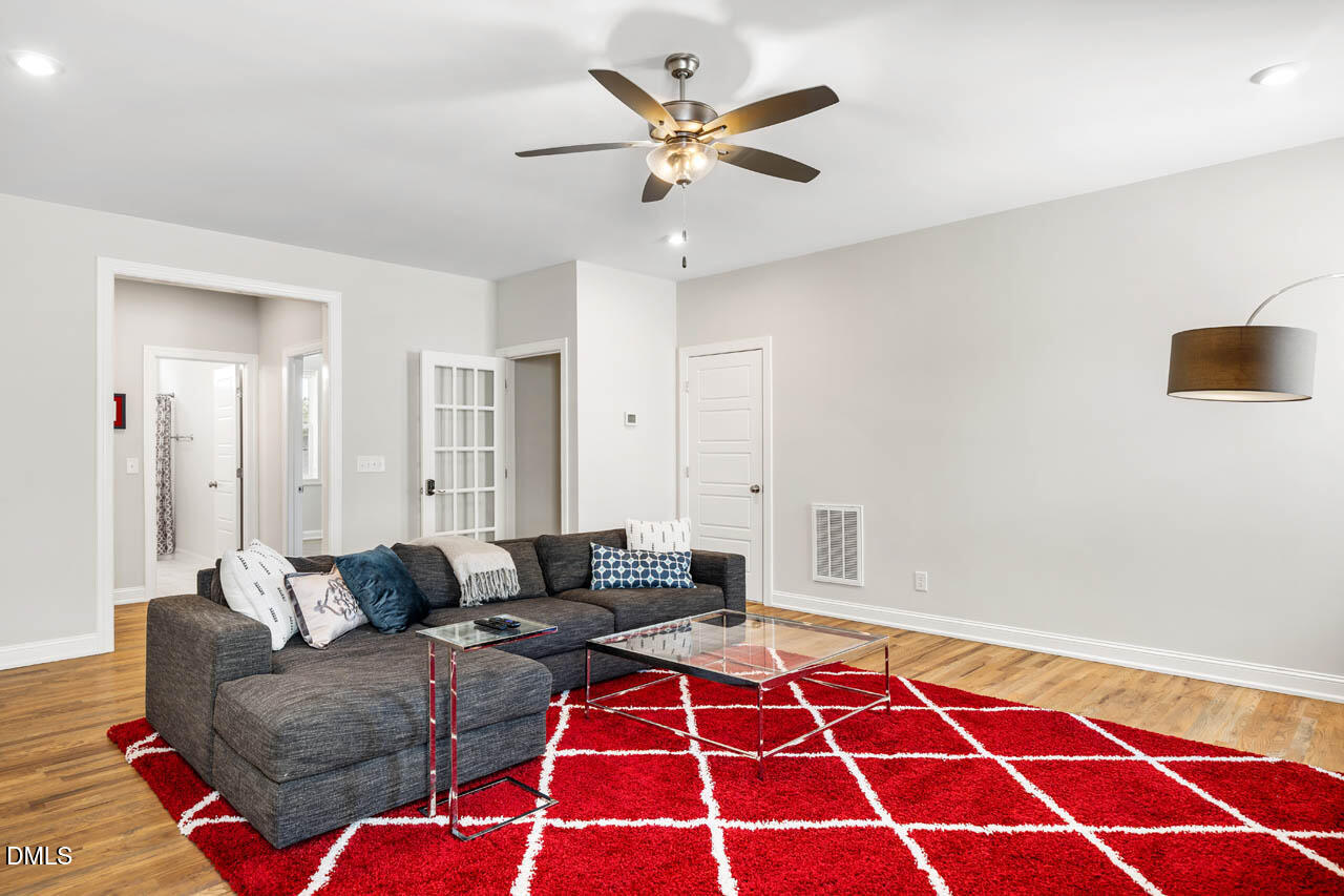 56 Post Oak Road Chapel Hill, NC 27516 - Photo 33 of 84 a living room with furniture and a rug
