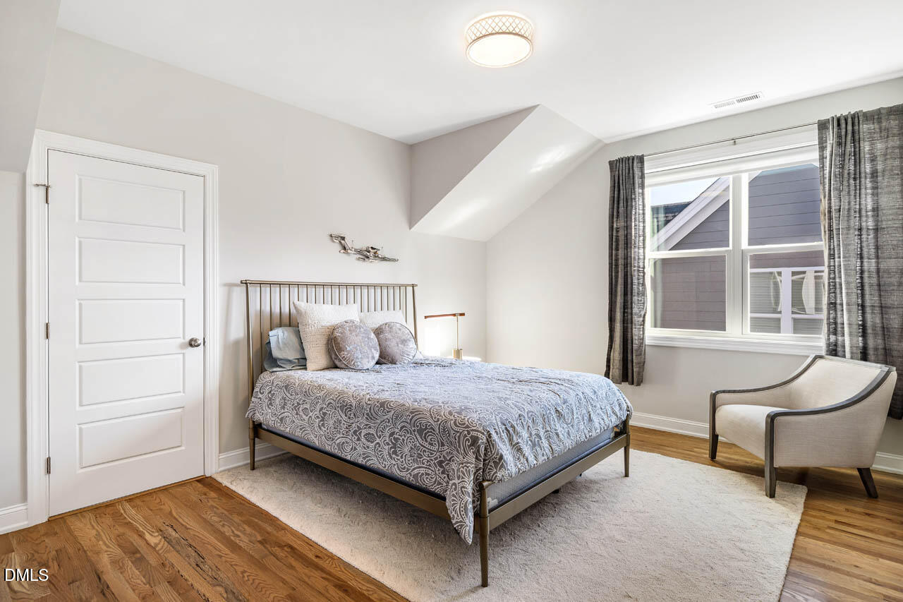 56 Post Oak Road Chapel Hill, NC 27516 - Photo 34 of 84 a bedroom with a bed and a window