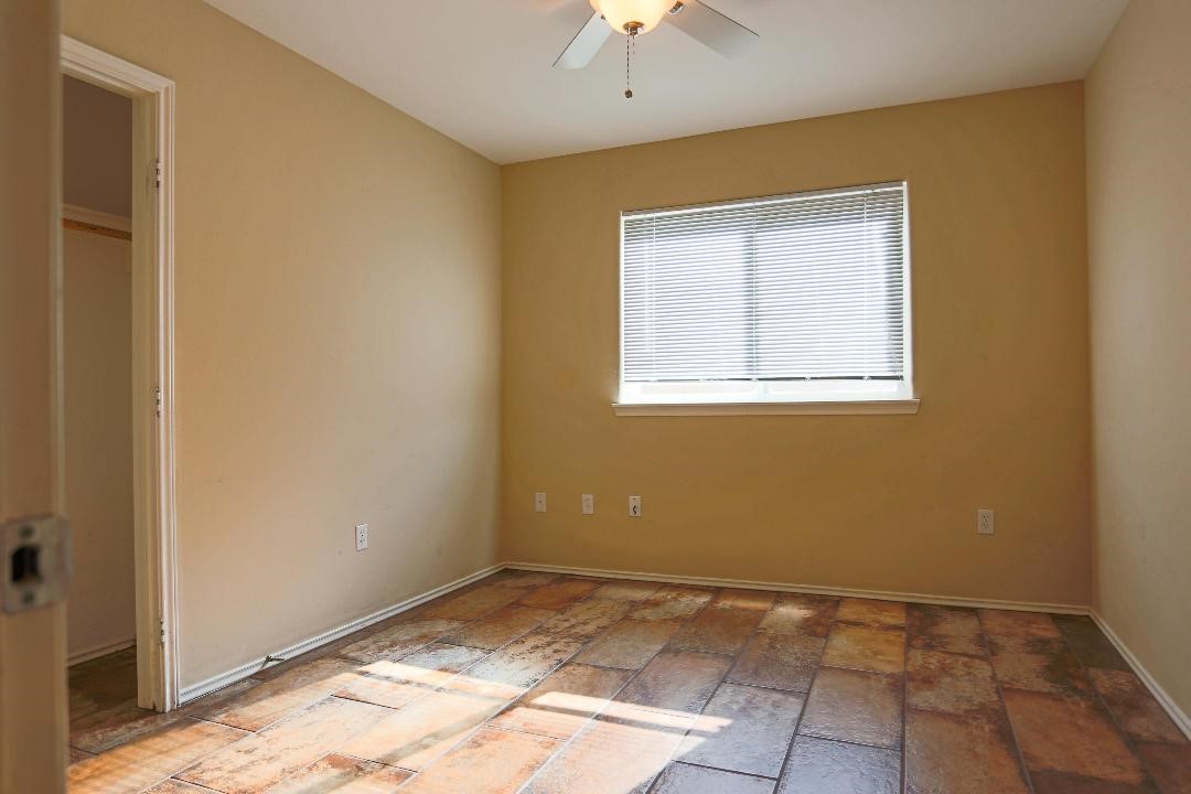 1114 Livermore Street Portland, TX 78374 - Photo 11 of 16 an empty room with windows