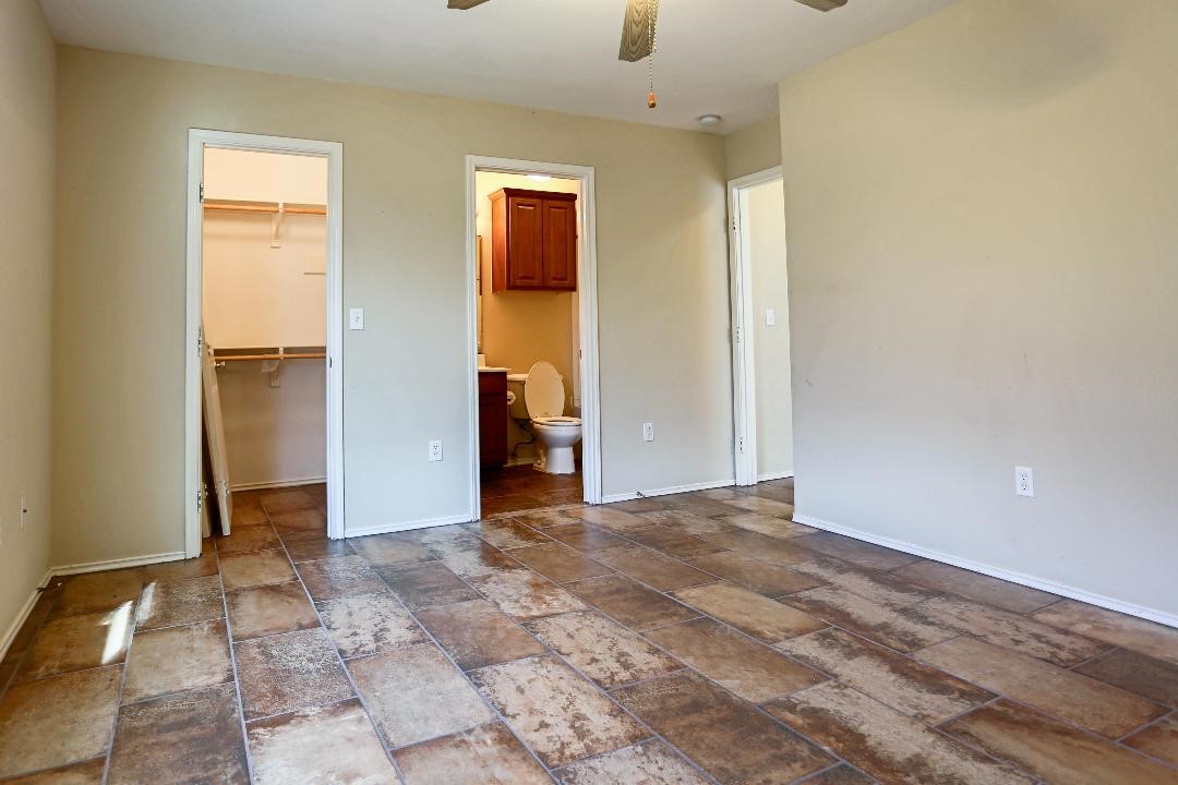1114 Livermore Street Portland, TX 78374 - Photo 13 of 16 an empty room with closet and a bathroom