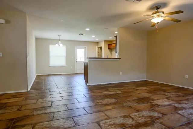 a view of an empty room and window