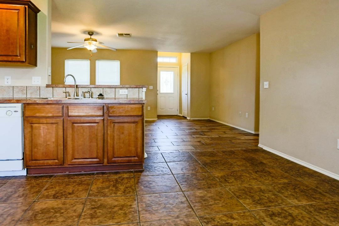 1114 Livermore Street Portland, TX 78374 - Photo 8 of 16 a bathroom with sinks a mirror and a shower