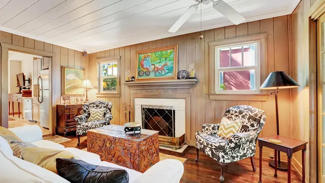 a view of a dining room with furniture and a chandelier