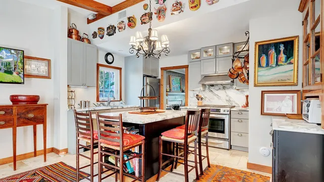 a dining room with furniture and wooden floor