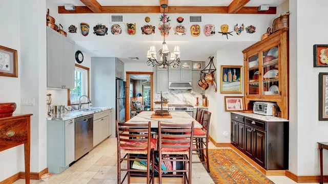 a kitchen with stainless steel appliances granite countertop a stove and a sink