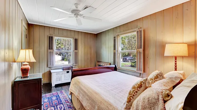 a bedroom with furniture and a window