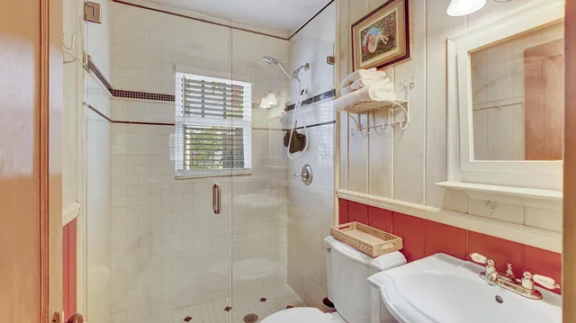 a front view of a house with a yard and flowers