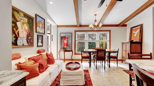 a dining room with furniture window and outside view