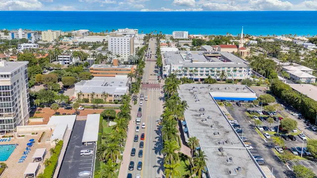 an aerial view of multiple houses with yard