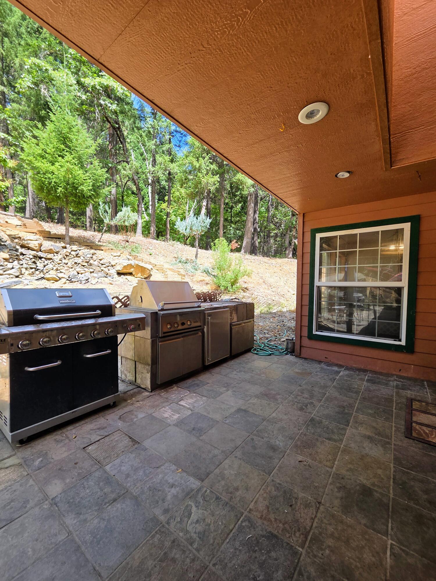 2940 Bear Creek Road Lewiston, CA 96052 - Photo 19 of 21 a kitchen with stainless steel appliances granite countertop a sink and a stove