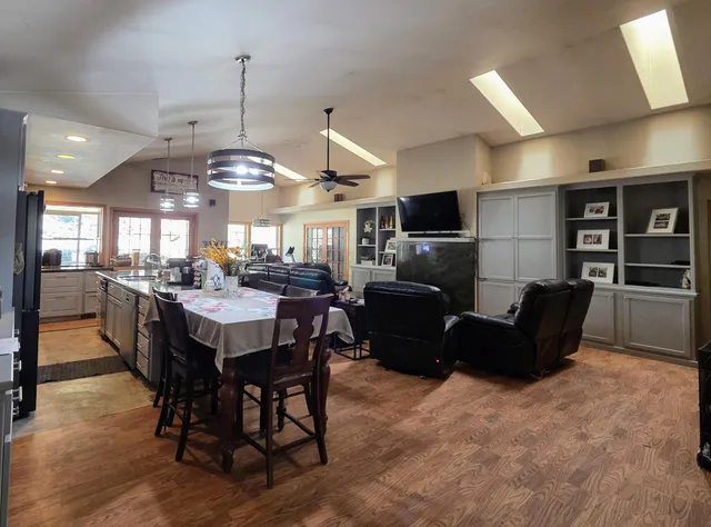 a kitchen with stainless steel appliances granite countertop a stove and a microwave