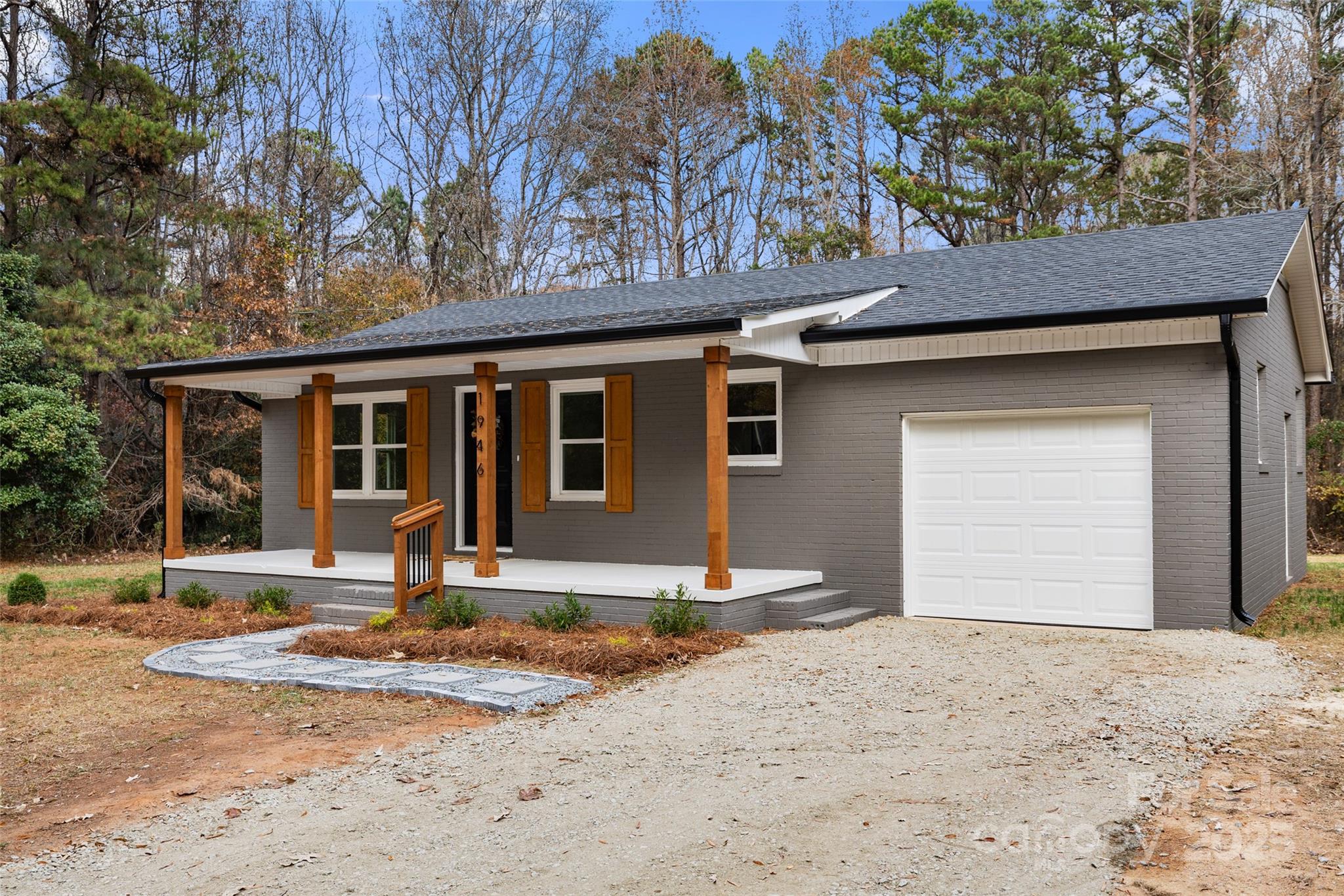1946 Robert Usher Road Lancaster, SC 29720 - Photo 3 of 15 a front view of a house with a yard and garage
