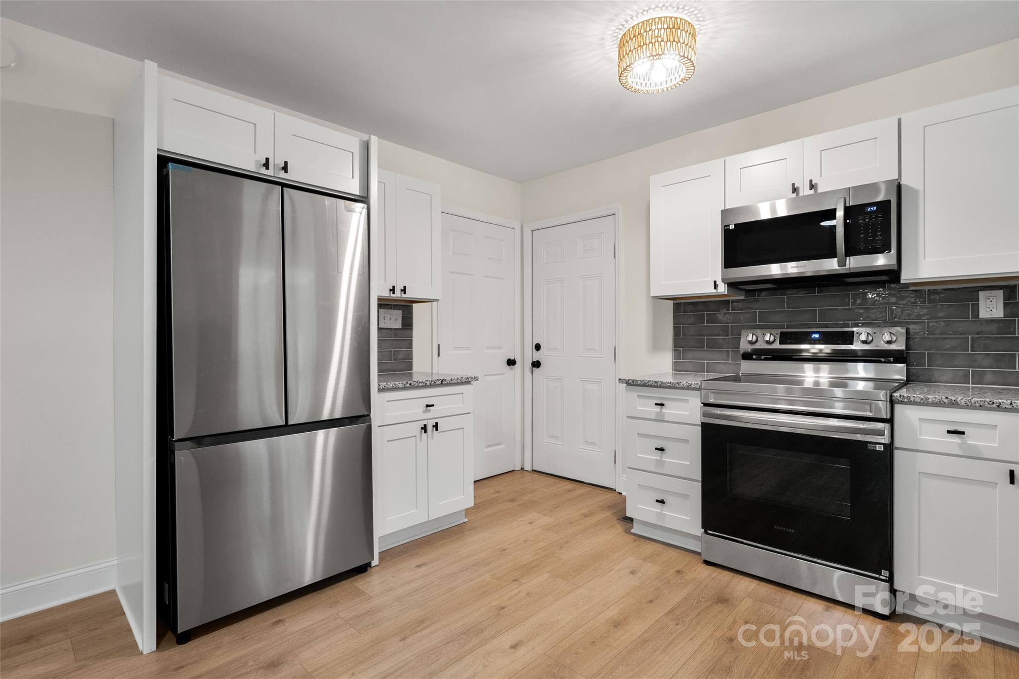 1946 Robert Usher Road Lancaster, SC 29720 - Photo 7 of 15 a kitchen with stainless steel appliances a refrigerator stove and microwave