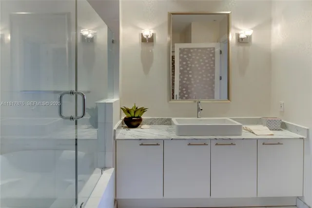 a bathroom with a sink and mirror