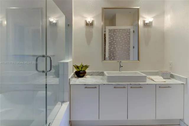 a bathroom with a sink and mirror