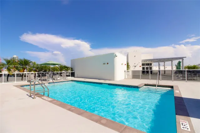 a view of a swimming pool with a patio