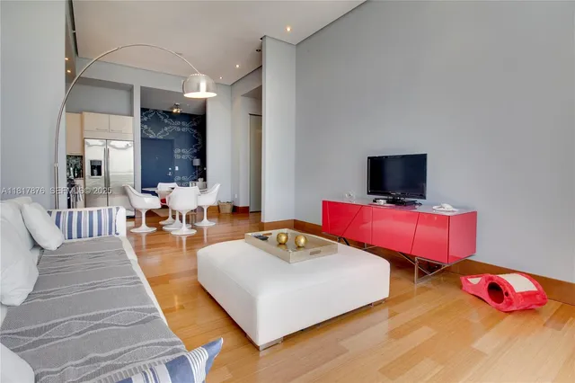 a living room with furniture and flat screen tv