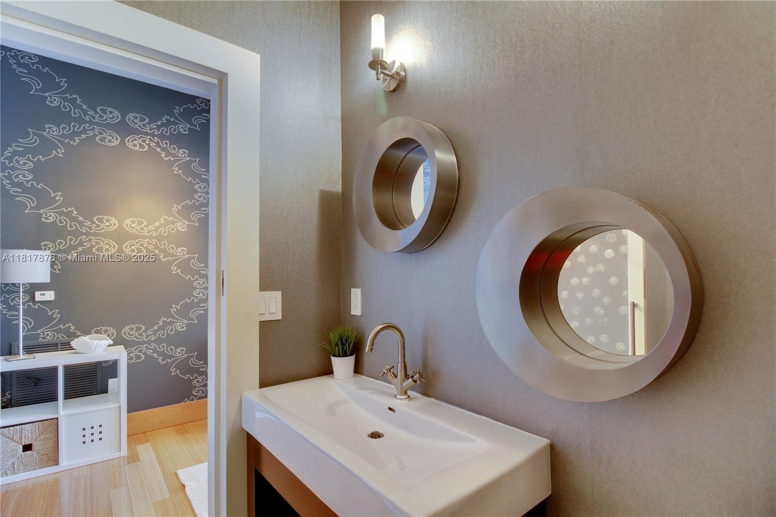 2001 Meridian Avenue, Unit PH21 Miami Beach, FL 33139 - Photo 9 of 14 a bathroom with a toilet and a sink