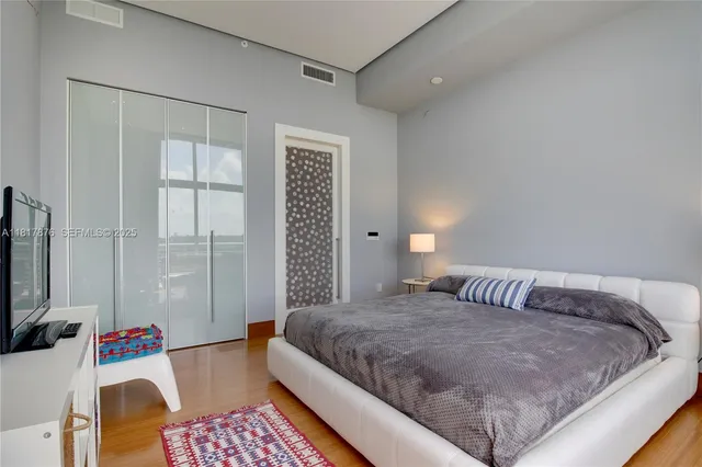 a bedroom with a bed and a couch