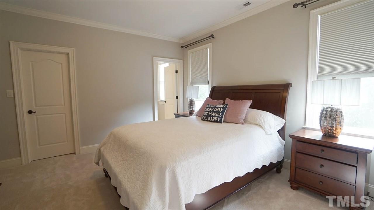 12512 Bayleaf Church Road Raleigh, NC 27614 - Photo 22 of 30 a bedroom with a bed and a dresser