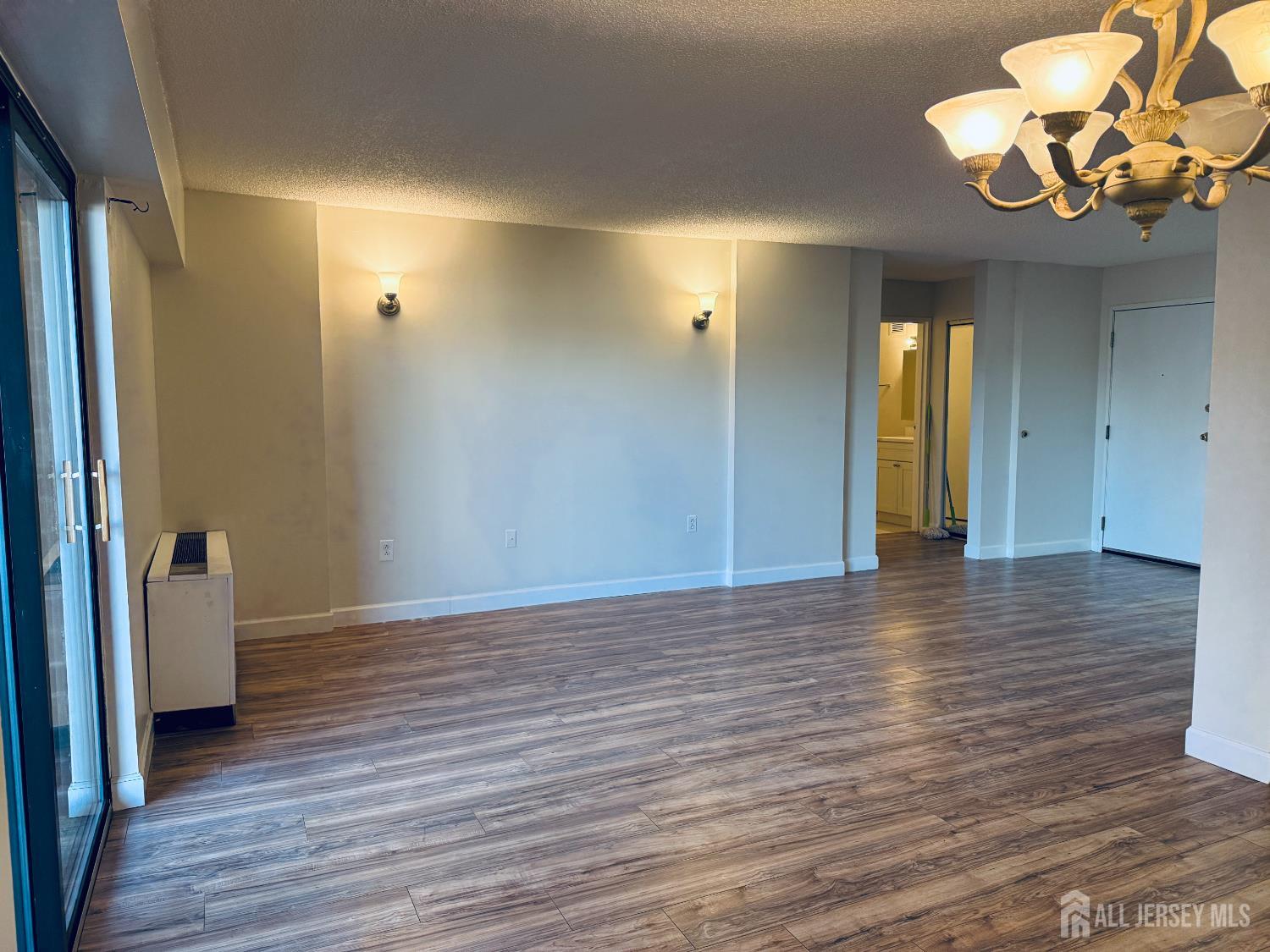 10 North Wood Avenue, Unit 314 Linden, NJ 07036 - Photo 1 of 18 a view of a room with wooden floor