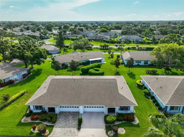 an aerial view of a house with a garden